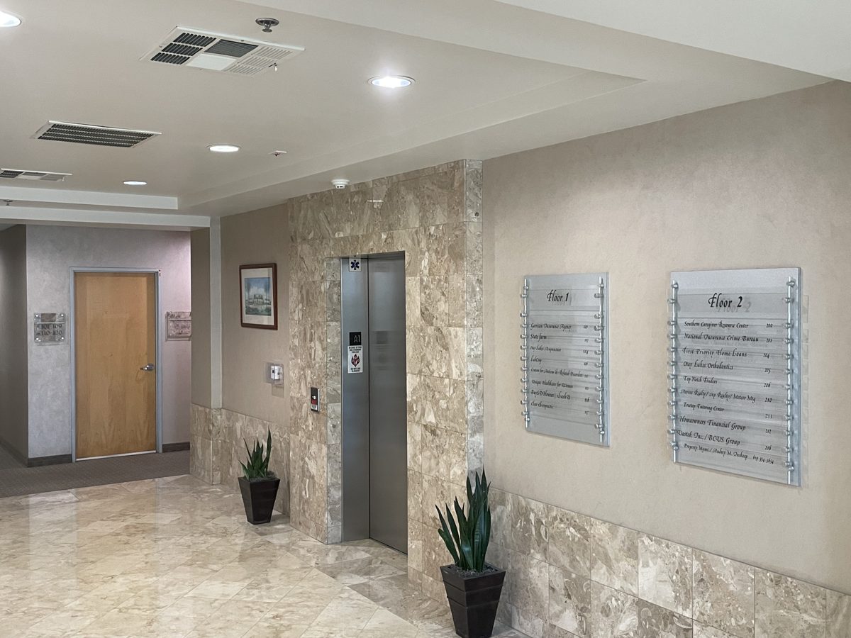Building lobby with elevator and tenant directory